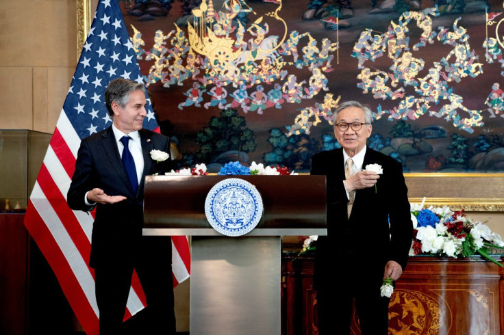 Thailand's Foreign Minister Don Pramudwinai and U.S. Secretary of State Antony Blinken display flowers on their jackets following remarks to the press after a Memorandum of Understanding signing ceremony at the Thai Ministry of Foreign Affairs in Bangkok,