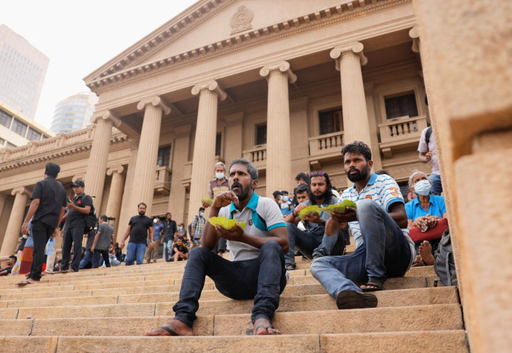 Demonstrators eat breakfast after entering the Presidential Secretariat premises, after President Gotabaya Rajapaksa fled, amid the country's economic crisis, in Colombo, Sri Lanka July 10, 2022. 