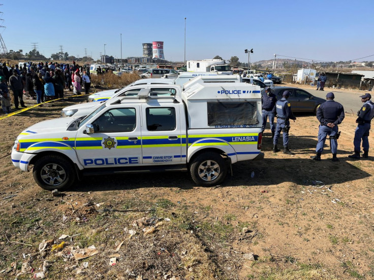 Police cordon off the scene where 15 people were killed by unknown gunmen inside a tavern, in Nomzamo, Soweto, Johannesburg, South Africa, July 10, 2022. 