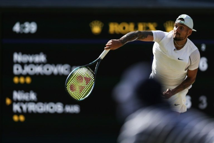 Nick Kyrgios serves to Novak Djokovic in the Wimbledon men's final