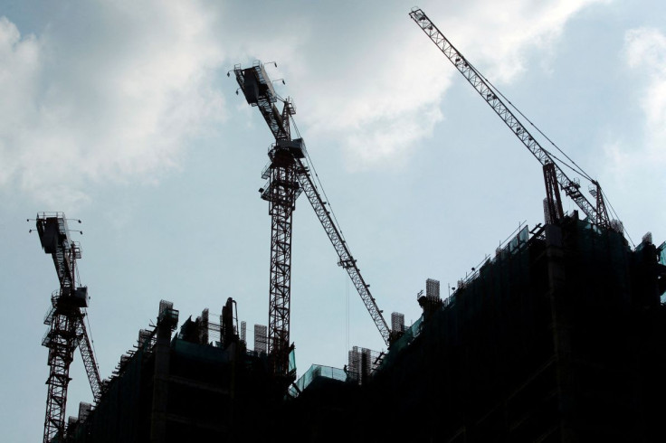 Workers work at the construction site of a new apartment in Jakarta, Indonesia, July 27, 2016. 