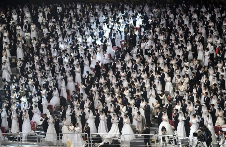 The Unification Church is known for holding mass weddings for thousands of couples, like this one held in South Korea in 2020 to mark the eighth anniversary of the death of founder Sun Myung Moon