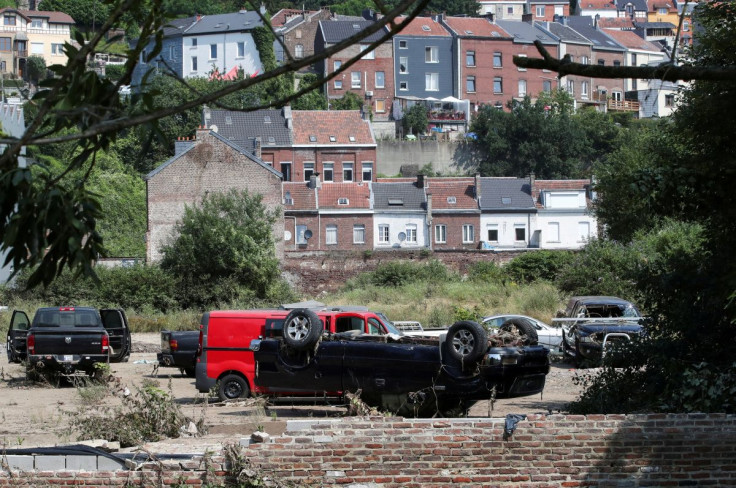 Destroyed cars are seen after heavy rainfall in Verviers, Belgium, July 23, 2021.