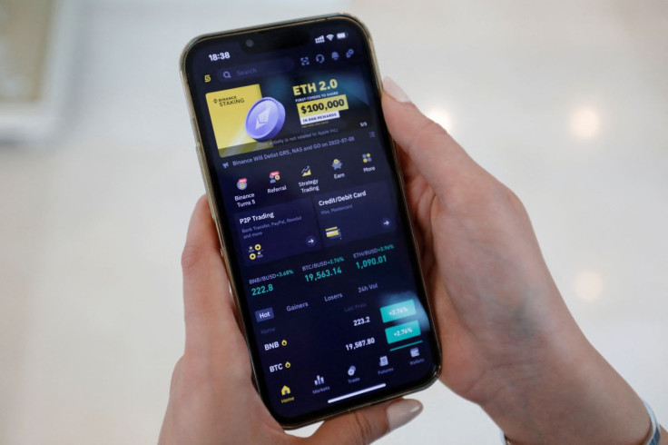 Asal Alizade, an Iranian trader on Binance, a cryptocurrency exchange platform, displays the mobile application on her smart phone in Dubai, United Arab Emirates, July 4, 2022.