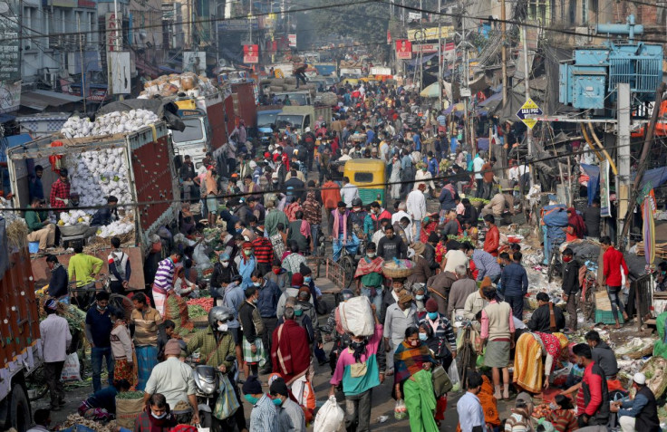 People shop in a crowded market amidst the spread of the coronavirus disease (COVID-19), in Kolkata, India, January 6, 2022. 