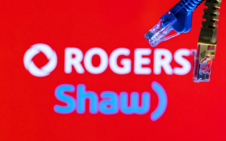 Ethernet cables are seen in front of Rogers and Shaw Communications logos in this illustration taken, July 8, 2022.