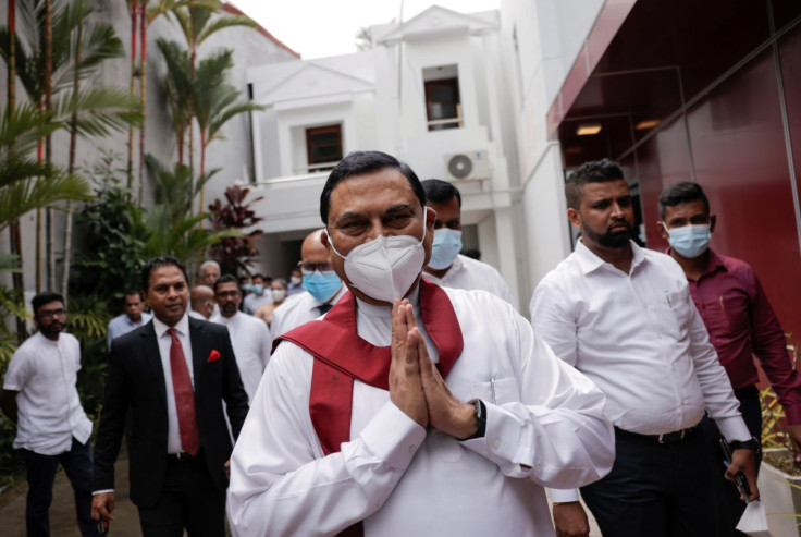 Basil Rajapaksa, one of the brothers of Sri Lanka's president Gotabaya Rajapaksa, gestures as he leaves after he announced that he had resigned from parliament, amid the country's economic crisis, in Colombo, Sri Lanka, June 9, 2022. 