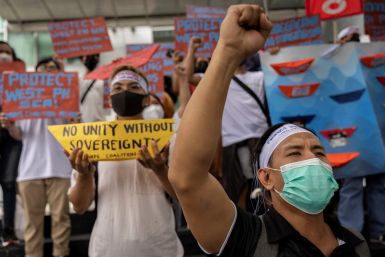 Filipino activists stage a protest on the sixth anniversary of an international tribunal ruling that invalidated China's historical claims in the South China Sea, outside the Chinese consular office in Makati City, Philippines, July 12, 2022. 