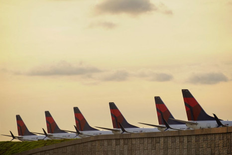 Delta Air Lines 737 passenger planes are seen lined up on a runway where they are parked due to flight reductions made to slow the spread of coronavirus disease (COVID-19), at Atlanta Hartsfield-Jackson International Airport in Atlanta, Georgia,  U.S. Mar
