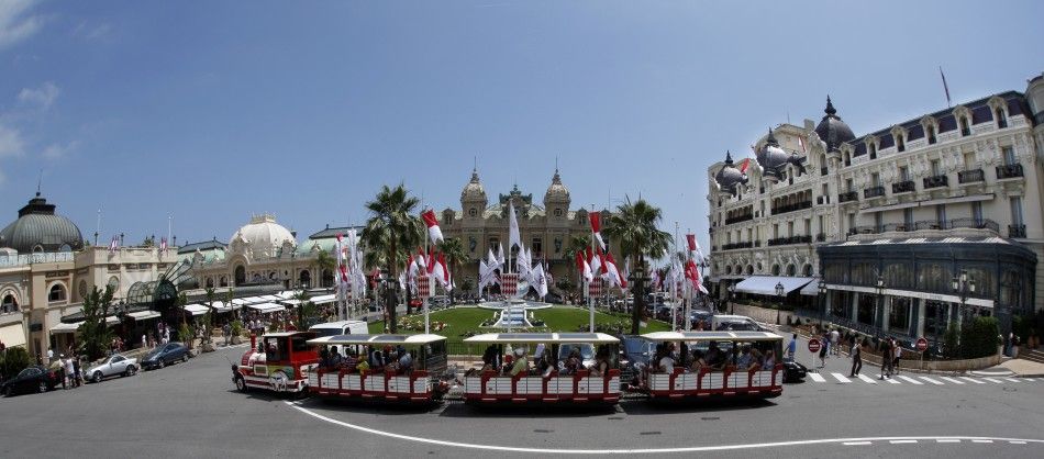 Flags announcing the wedding of Prince Albert II of Monaco and his fiancee Charlene Wittstock are seen at the Monaco Casino square