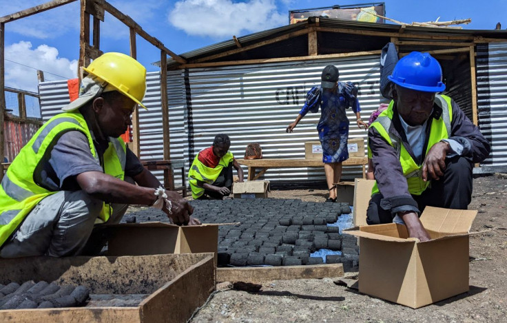 Bavon Mubake a member of the rehabilitation centre for the elderly and a technician of the Carrefour de Facilitation pour les indigents (CAFI) and Sylvestere Bin Kyuma arrange eco-friendly cooking charcoal in Bukavu, South Kivu in the east of the Democrat