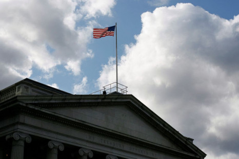 The United States flag flies atop the U.S. Treasury Department in Washington November 18, 2008. 