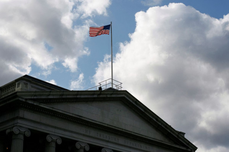 The United States flag flies atop the U.S. Treasury Department in Washington November 18, 2008. 