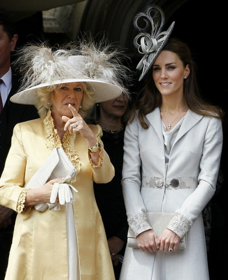 Catherine, Duchess of Cambridge chats with Camilla Duchess of Cornwall during the procession pass of the Order of The Garter Service in Windsor