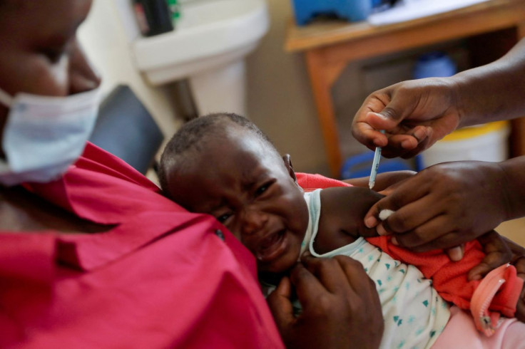 A nurse administers the malaria vaccine to an infant at the Lumumba Sub-County hospital in Kisumu, Kenya, July 1, 2022.
