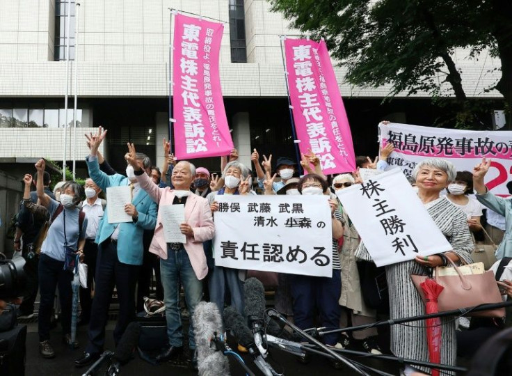 Plaintiffs and their lawyers hailed the ruling outside a Tokyo court