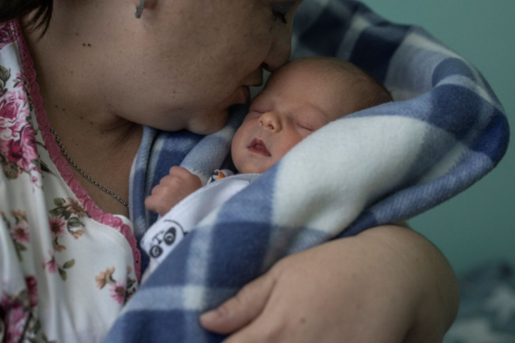 Iryna Salamatina, 36, kisses her son Anton inside Pokrovsk maternity hospital, Donetsk region, eastern Ukraine, June 28, 2022. Doctors at the centre anecdotally observed that the smouldering conflict, which would kill more than 14,000 people between 2014