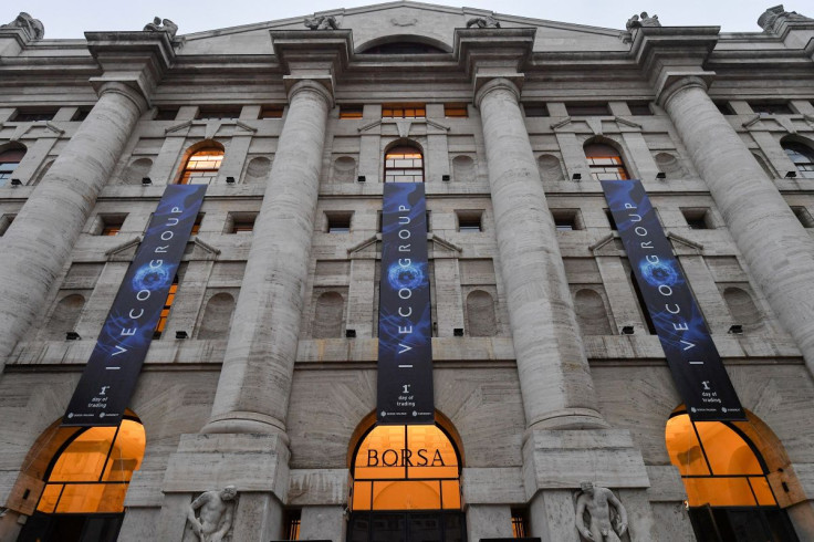 Banners with the logo of Iveco Group hang outside the Milan Bourse (Italian stock exchange) on the day truckmaker Iveco Group starts trading there, in Milan, Italy, January 3, 2022. 