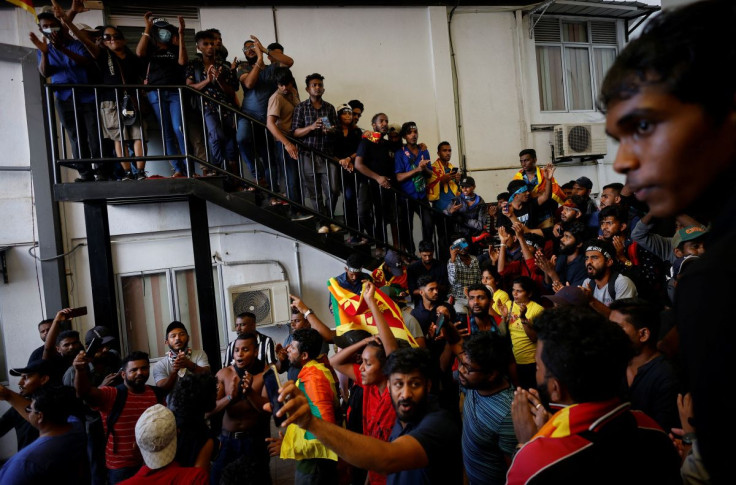 Protestors celebrate after entering the Sri Lanka's Prime Minister Ranil Wickremesinghe's office premises, amid the country's economic crisis, during a protest in Colombo, Sri Lanka July 13, 2022. 