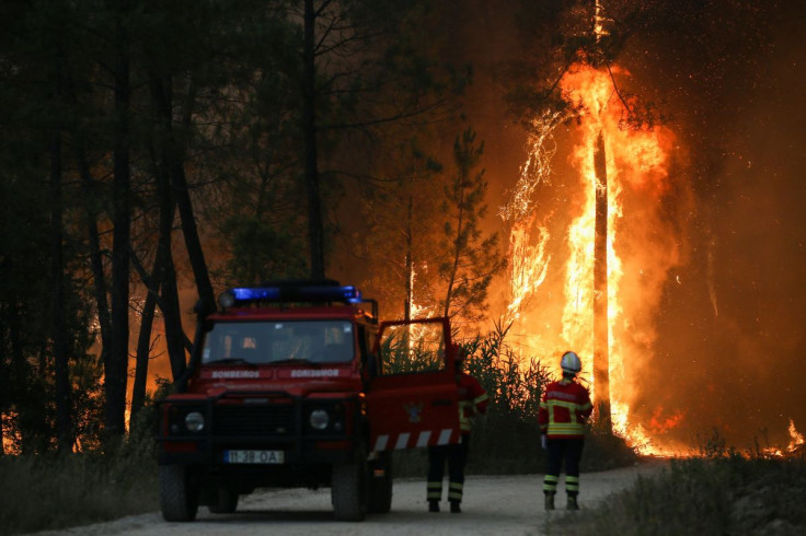 Firefighters watch a wildfire in Ourem, Santarem district, Portugal July 12, 2022.