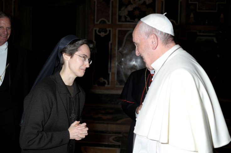 Italian nun Sister Raffaella Petrini, who is the first woman to be appointed as the number two position in the governorship of Vatican City, is greeted by Pope Francis in this undated handout photo released by the Vatican on November 5, 2021. Vatican Me