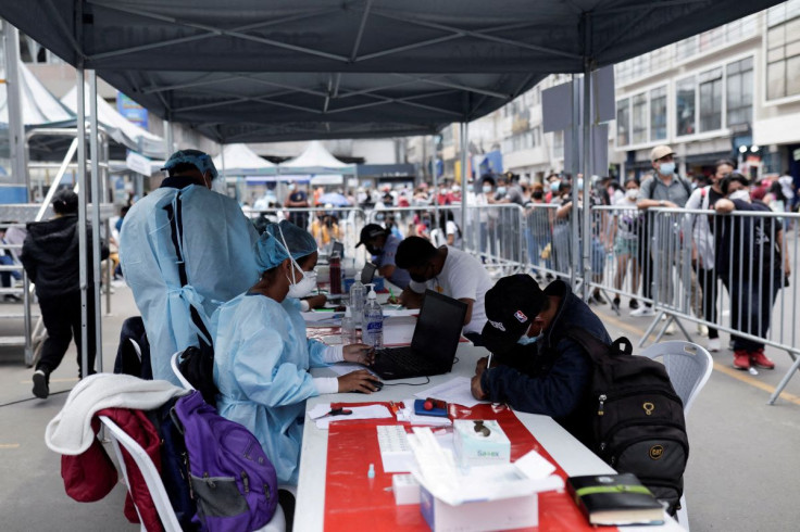 Healthcare workers register people to be tested for the coronavirus disease (COVID-19) as Peru raised its pandemic alert level in various cities and tightened some restrictions due, to a third wave of infections caused by the spread of the Omicron variant