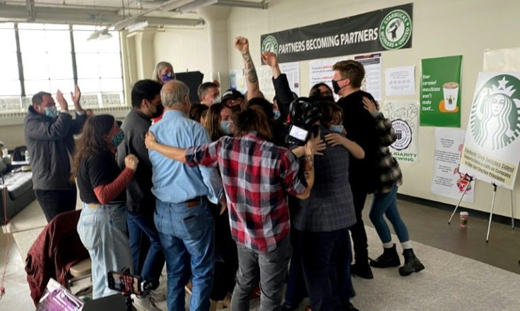 Workers at a Buffalo Starbucks celebrate in December 2021 after they established the chain's first union at a US store