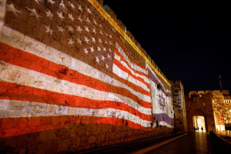 U.S. and Israeli national flags are projected on a part of the walls surrounding Jerusalem's Old City July 13, 2022. 