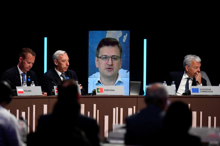 Ukrainian Foreign Minister Dmytro Kuleba speaks as Portuguese Foreign Minister Joao Gomes Cravinho, Polish Foreign Minister Zbigniew Rau and EU Commissioner Didier J.L. Reynders take part in a meet to coordinate efforts to investigate and put on trial all