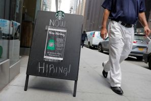A sign advertising job openings is seen outside of a Starbucks in Manhattan, New York City, New York, U.S., May 26, 2021. 