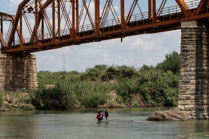 Asylum seeking migrants cross the Rio Grande river into the U.S. from Mexico at Piedras Negras, Mexico, July 13, 2022.