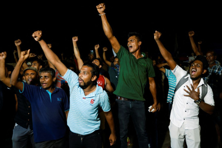 People dance as they celebrate the resignation of Sri Lankaâs President Gotabaya Rajapaksa at a protest site, amid the countryâs economic crisis, in Colombo, Sri Lanka July 14, 2022.