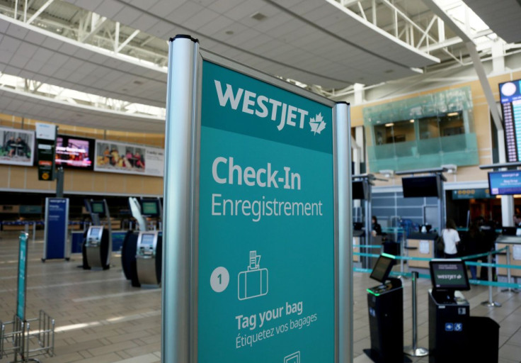 WestJet airline signage is pictured at Vancouver's international airport in Richmond, British Columbia, Canada, February 5, 2019.