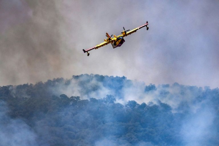 Planes dropped loads of water to extinguish fires tearing through Morroco's terrain
