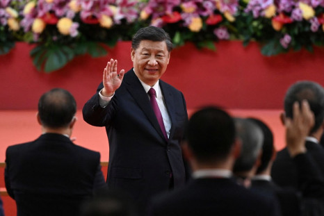 China's President Xi Jinping waves following his speech after a ceremony to inaugurate the city's new leader and government in Hong Kong