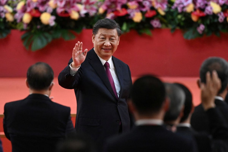 China's President Xi Jinping waves following his speech after a ceremony to inaugurate the city's new leader and government in Hong Kong