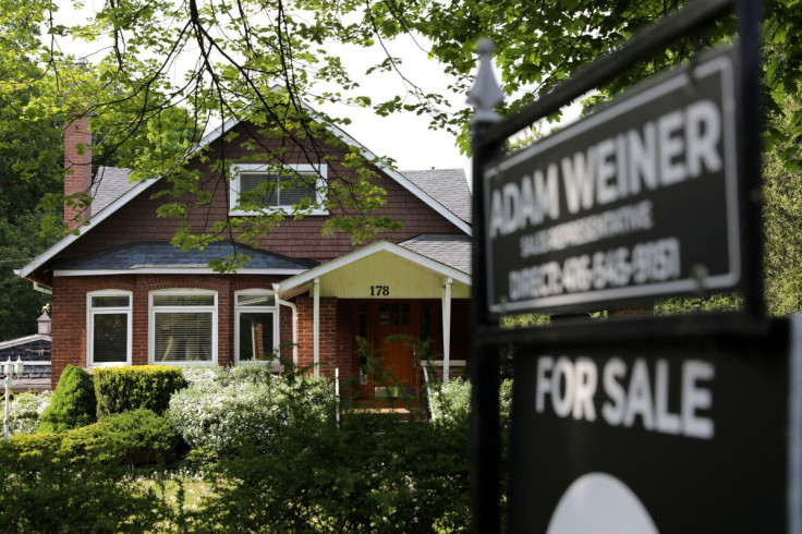 A realtor's sign stands outside a house for sale in Toronto, Ontario, Canada May 20, 2021. 