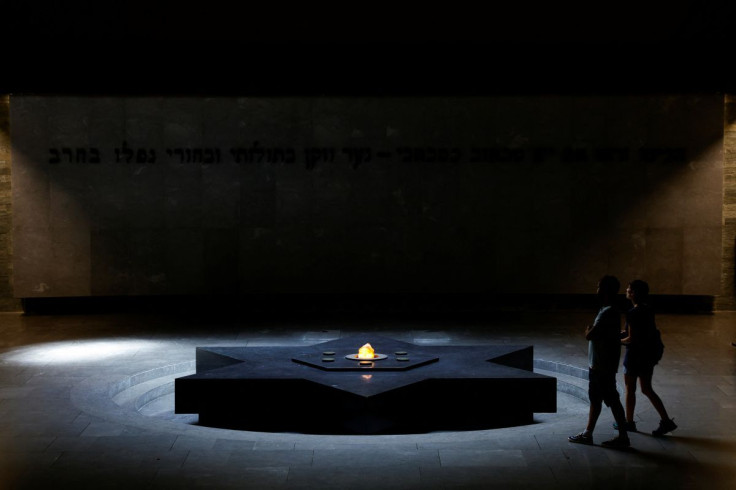 People visit the crypt inside the Shoah Memorial as France commemorates the 80th anniversary of the Vel d'Hiv roundup, in Paris, France, July 12, 2022.