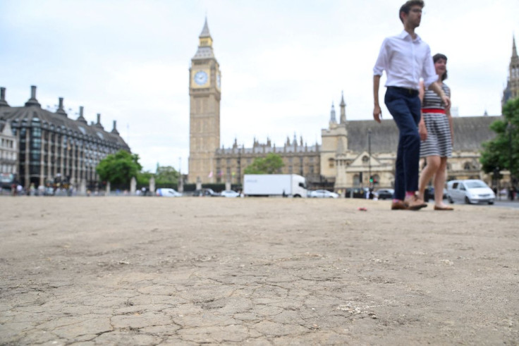 A general view of cracked earth with the houses of Parliament and the Elizabeth Tower, more commonly known as Big Ben, seen behind as hot weather continues, in Parliament Square, London, Britain, July 12, 2022. 