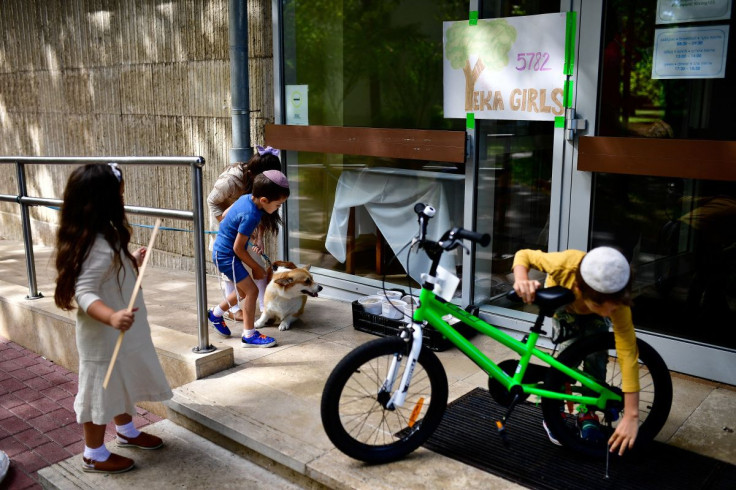 Hasidic Jewish refugee children from Ukraine play in a kosher rescue village at the shores of Lake Balaton in Balatonoszod, Hungary July 11, 2022.