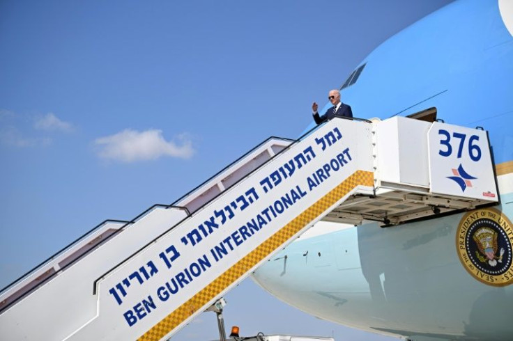 US President Joe Biden gives a salute before boarding Air Force One to depart Israel's Ben Gurion Airport on July 15, 2022
