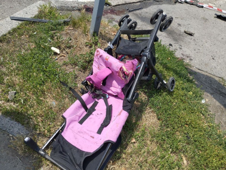 Liza Dmitrieva's damaged pram lies on the road following a Russian missile strike, as Russia's invasion of Ukraine continues, in Vinnytsia, Ukraine, July 14, 2022. State Emergency Services of Ukraine/Handout via REUTERS