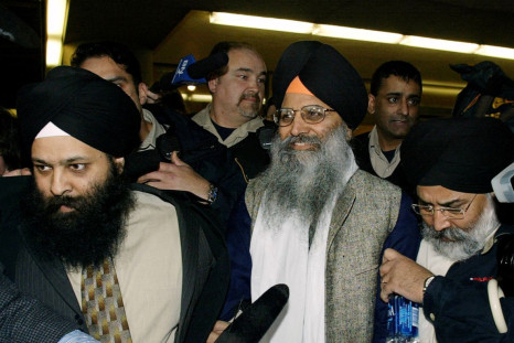 Sikh activist Ripudaman Singh Malik (C) smiles as he leaves a Vancouver court March 16, 2005, after being found not guilty in the 1985 bombing of an Air India flight off the Irish coast. 
