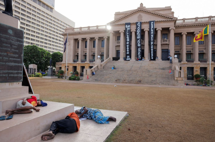 Demonstrators sleep at the Presidential Secretariat after Parliament Speaker Mahinda Yapa Abeywardena officially announced the resignation of president Gotabaya Rajapaksa who fled to Singapore amid Sri Lanka's economic crisis, in Colombo, Sri Lanka, July