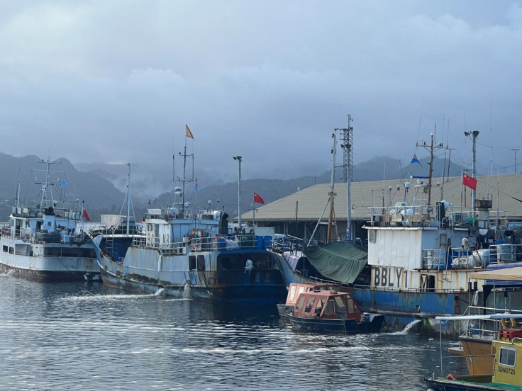 Chinese flagged fishing boats unload tuna at Princess Wharf in Suva, Fiji July 16, 2022. 