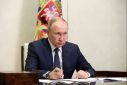 Russian President Putin chairs a meeting outside Moscow