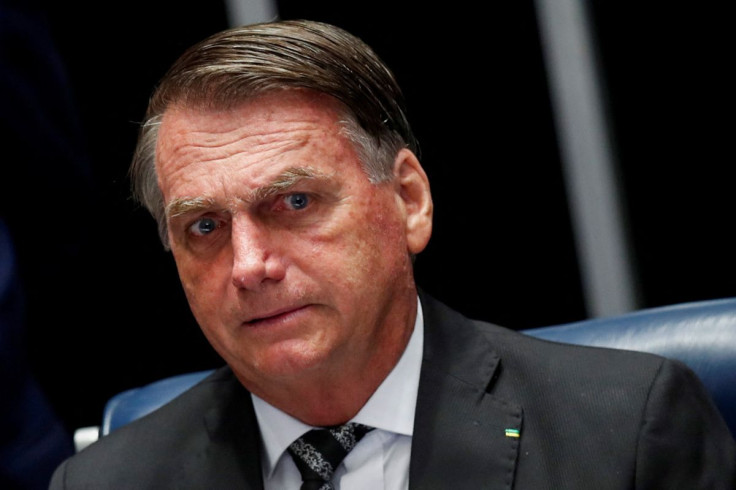 Brazil's President Jair Bolsonaro looks on during a session of the National Congress to decree amends to the constitution to bypass the country's spending cap and boost social benefits, in Brasilia, Brazil July 14, 2022. 