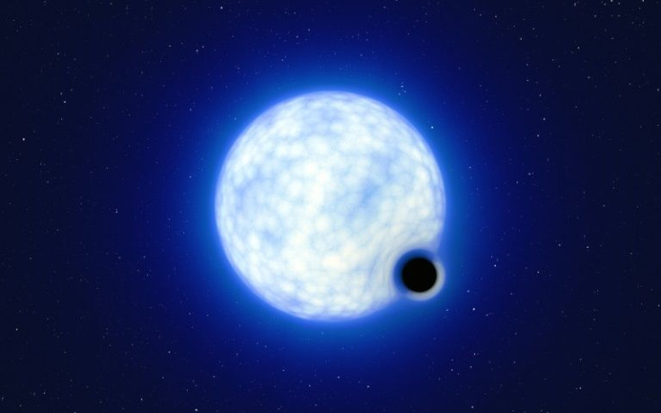An artist's impression of the 'dormant' black hole, quietly orbiting its companion star