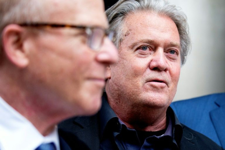 Former White House Chief Strategist Steve Bannon (R) speaks to reporters as he leaves the United States District Court House in Washington, DC on the first day of jury selection in his trial for contempt of Congress, on July 18, 2022