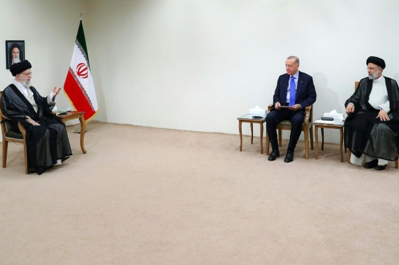 Iran's supreme leader Ayatollah Ali Khamenei speaks with Turkey's President Recep Tayyip Erdogan, who is seated alongside Iran's President Ebrahim Raisi